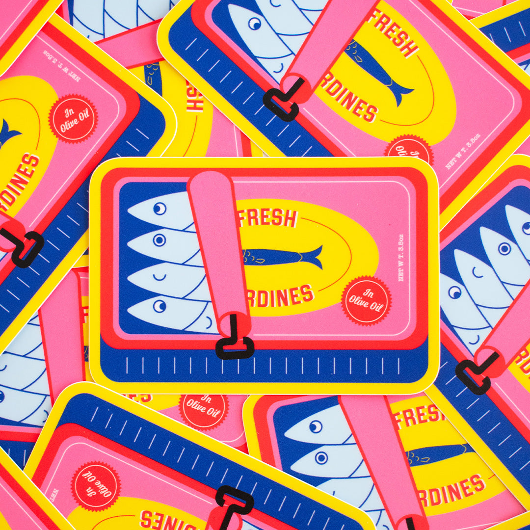 A playful assortment of The Perfect Sardine Can Vinyl Stickers stacked on one another.