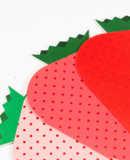 Three colors of the Mini Greeting Card shaped like a strawberry, perfect for sending cheerful notes.