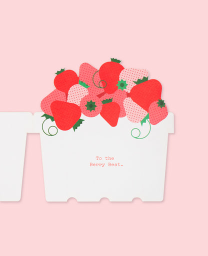 Opened Love and Friendship Card featuring a basket of fresh strawberries on a pastel pink background.